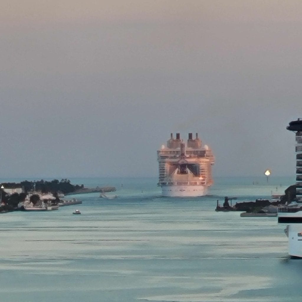 Cruise ship Sailing away at sunset