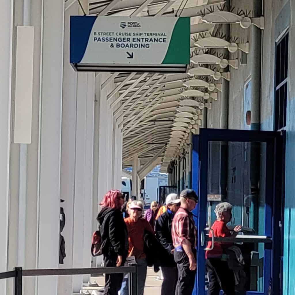 People entering a cruise terminal