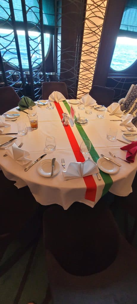 Dining Table formally set with an Italian table runner