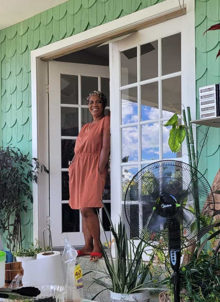 Caribbean woman standing in the doorway