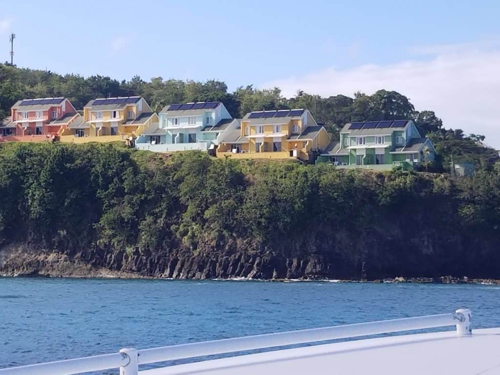 Row of Caribbean houses on the cliffside