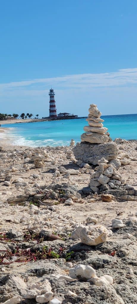 Lighthouse and rock formation at the beach