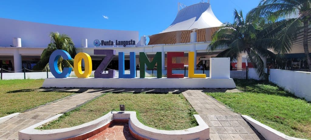 The word COZUMEL in large colorful letters 