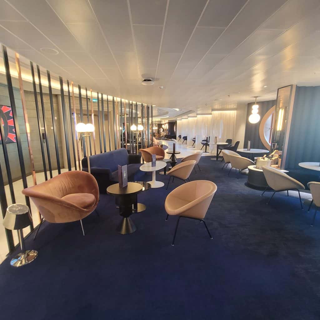 Lounge area on a Virgin Voyages cruise ship