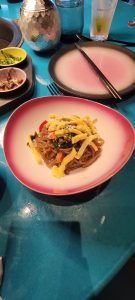 Plate of food from Gunbae restaurant on Virgin Voyages