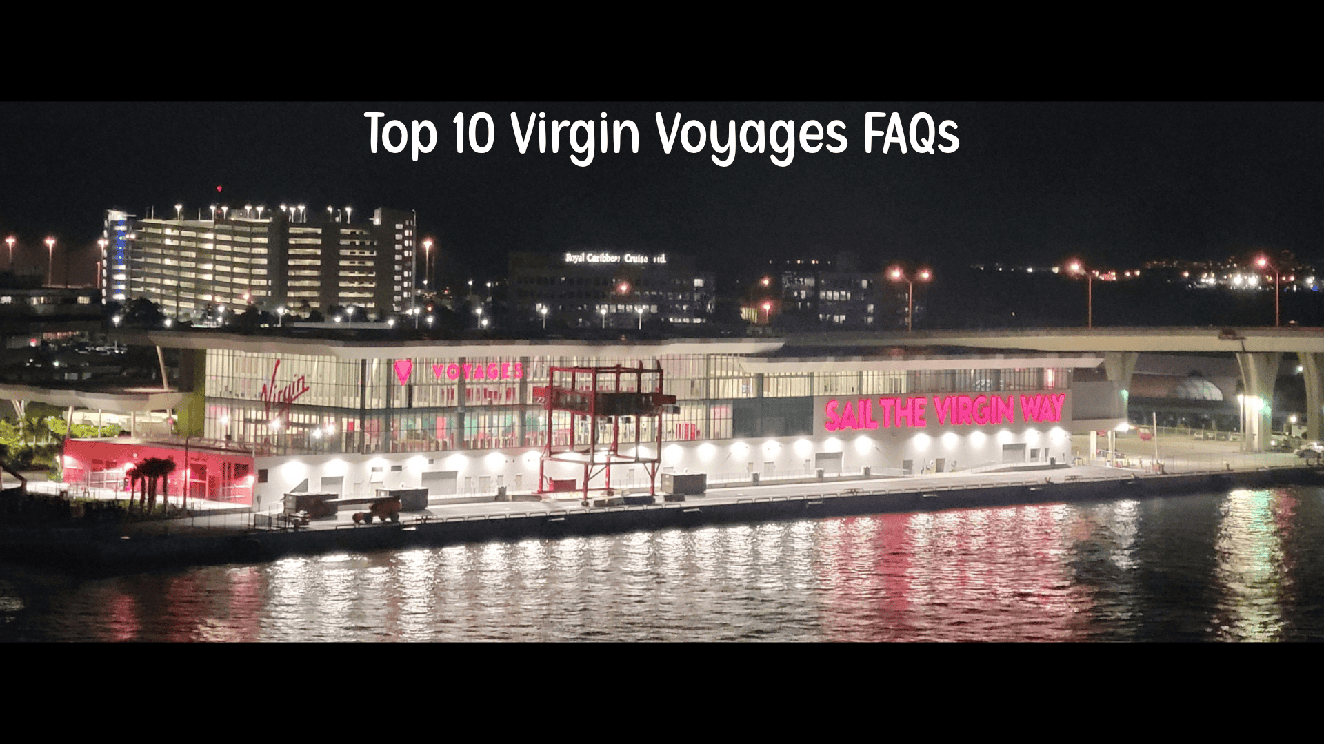 Virgin Voyages cruise terminal at night with Sail the Virgin Way sign – featured image for Top 10 Virgin Voyages FAQs