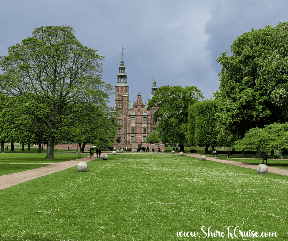 Cloudy day at Rosenborg Castle Gardens in Copenhagen — a reminder to pack layers and rain gear for Northern Europe cruises.