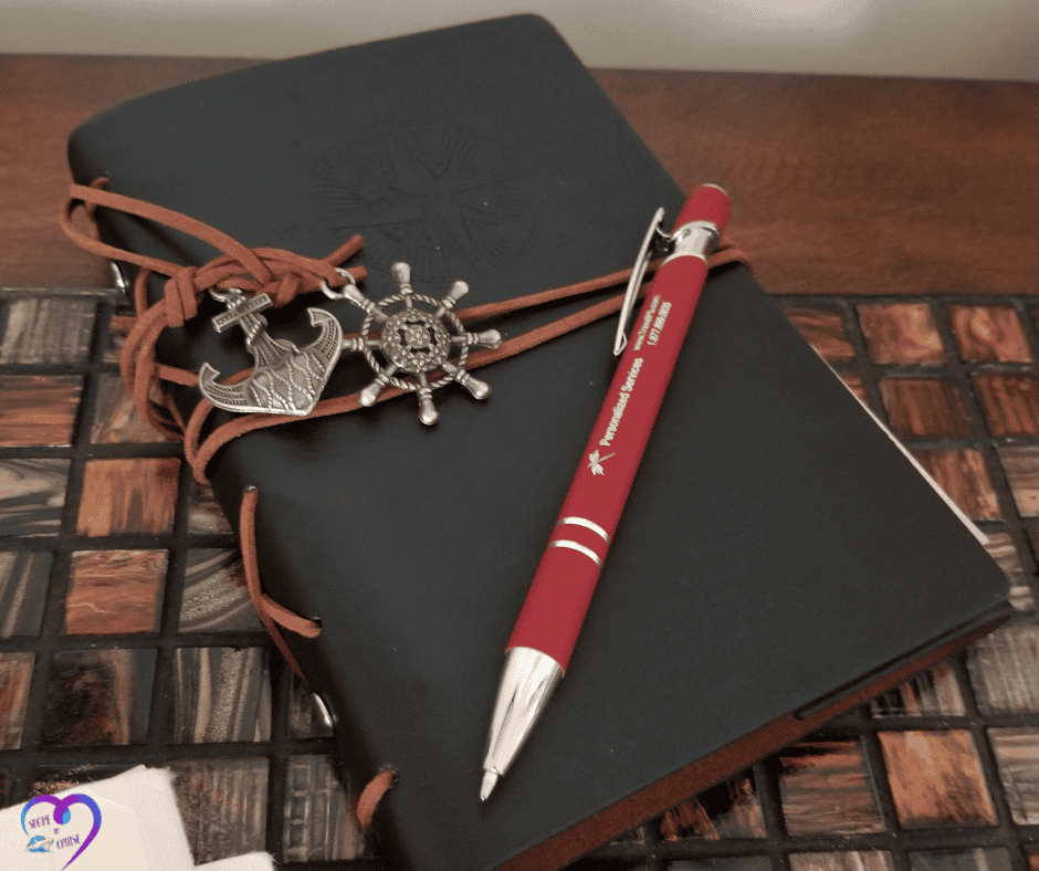 Traveler’s cruise journal on desk symbolizing last-minute packing notes