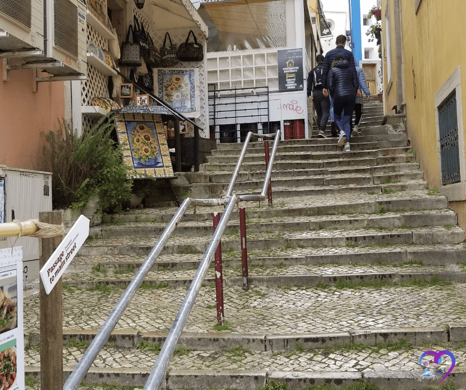 Travelers exploring cobblestone streets with daypacks during a European shore excursion.