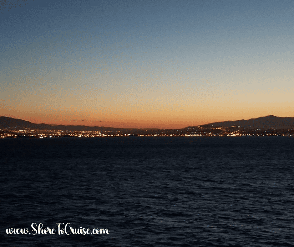 Soft orange horizon over the Mediterranean Sea at dusk — relaxed cruise evening atmosphere for dinner and cocktails.