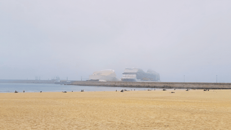 Foggy morning view of a cruise ship in port, capturing the cool, misty weather travelers can expect on a Northern Europe cruise.