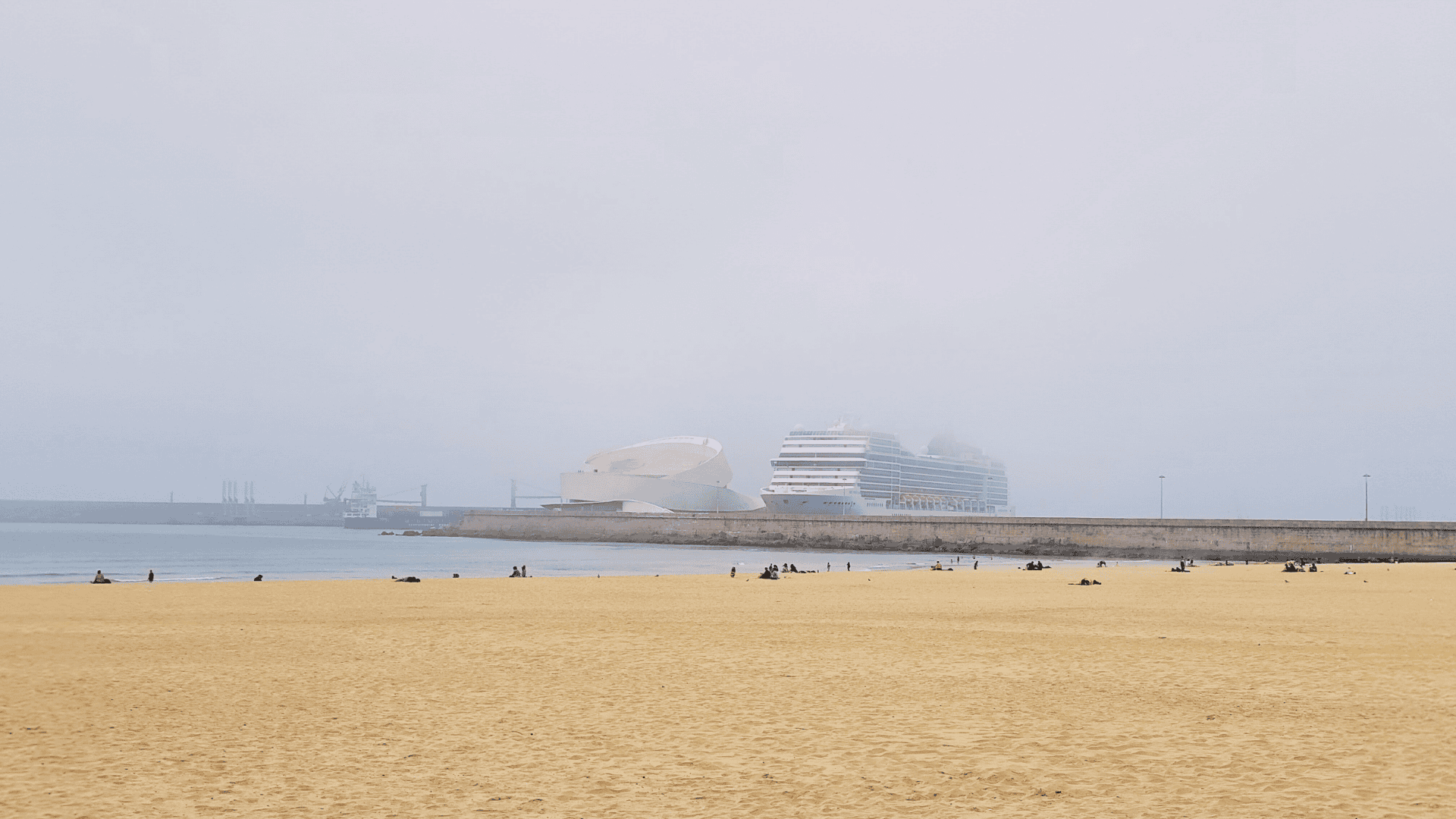 Foggy morning view of a cruise ship in port, capturing the cool, misty weather travelers can expect on a Northern Europe cruise.