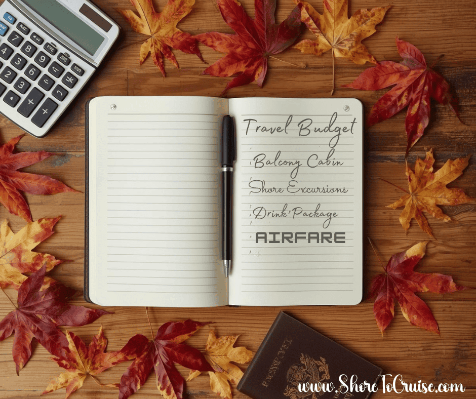 Open notebook and calculator on a desk decorated with autumn leaves and warm fall lighting.