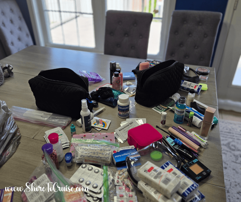 Cruise first aid kit supplies organized on a table before packing, including medications, wipes, and travel essentials.