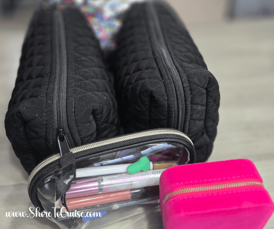 Black quilted cosmetic bags used as a cruise first aid kit, shown with a small pink case for travel essentials.